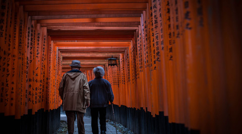 The picture shows a couple taking a walk