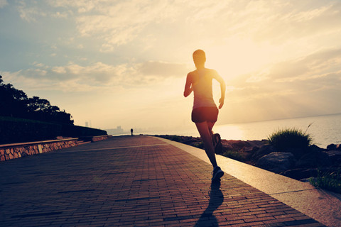 The picture shows a jogging girl