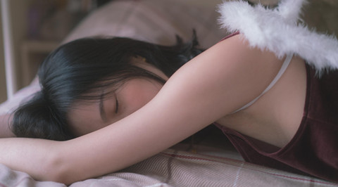 The picture shows a sleeping girl
